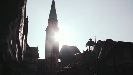 Old-St.-Nicholas-Church-Tower-and-Frankfurt-Christmas-Market-Backlit-by-Sunlight