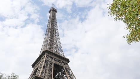 Lattice-construction-of-Eiffel-tower-and-symbol-of-France-in-front-of-cloudy-sky-4K-2160p-UltraHD-footage---Paris-and-French-recognizable-Tour-Eiffel-by-the-day-4K-3840X2160-30fps-UHD-video