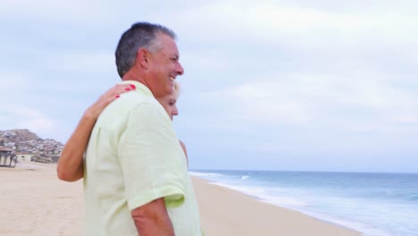 An-older-couple-looking-out-at-the-ocean