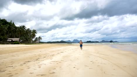 Man-running-on-the-beach