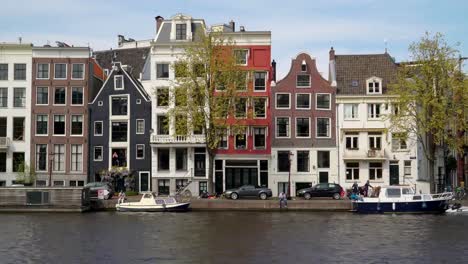 Boats-docking-and-cars-parking-on-the-side-of-the-canal