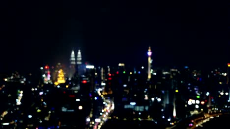 Unschärfe-oder-Bokeh-Licht-der-Metropole-Kuala-Lumpur-für-Hintergrund-Konzept.