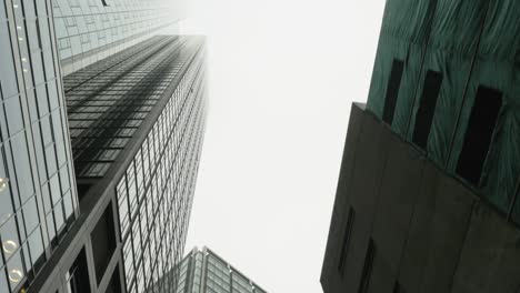 Driving-Directly-Below-Skyscrapers-in-Frankfurt,-Germany