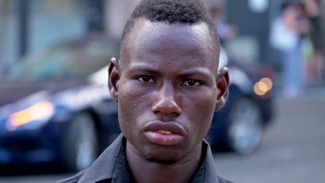 close-up-portrait-of-Proud-confident-young-african-man-staring-at-camera--outdoor