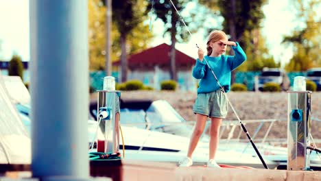 Girl-is-holding-the-fishing-rod