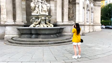 Woman-walking-in-city.-Young-attractive-tourist-outdoors-in-european-city