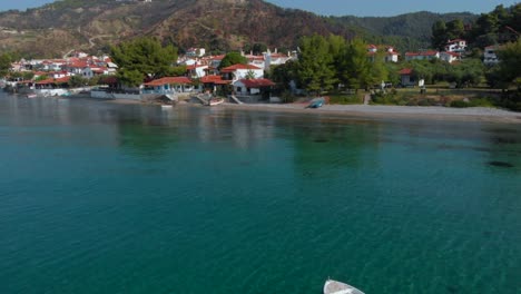 Aerial-view-of-the-small-Greek-village-on-the-shore-of-the-Aegean-Sea