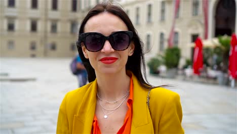 Woman-walking-in-city.-Young-attractive-tourist-outdoors-in-italian-city