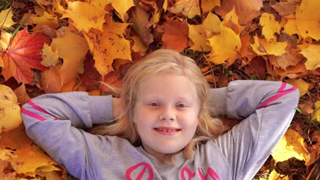 portrait-of-a-beautiful-girl-in-the-autumn-park-portrait-of-a-beautiful-girl-in-the-autumn-park-on-fallen-leaves