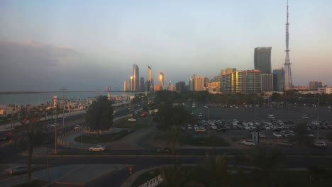 Beautiful-view-of-Abu-Dhabi-city-skyline-and-corniche-street-at-sunset