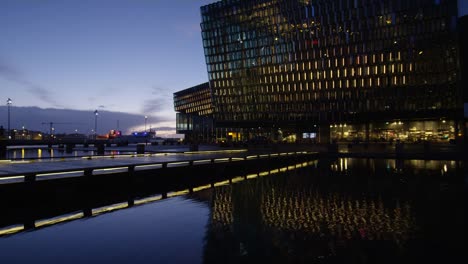 Tourist-Taking-Pictures-of-Galeria-Harpa,-Timelapse