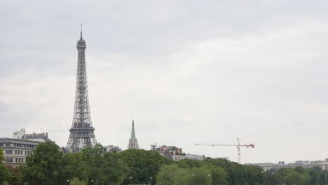 Construction-of-steel-Eiffel-tower-by-the-day-slow-tilt-3840X2160-UHD-footage---Tilting-on-famous-French-Eiffel-tower-in-Paris-4K-2160p-30fps-UltraHD-tilting--video