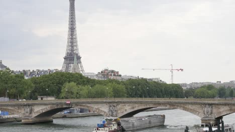 French-famous-Eiffel-tower-near-river-Seine-by-the-day-slow-tilt-4K-2160p-30fps-UltraHD-video---Tilting-on-famous-scenery-of-France-and-Paris-4K-3840X2160-UHD-footage