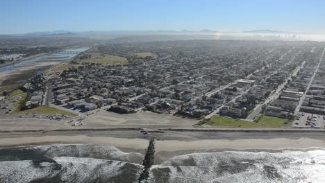 aerial-san-diego-beach-tracking-distant-city