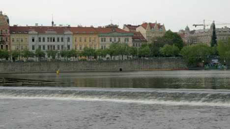 View-of-Prague-cityscape-moving-along-the-Vltava-river-on-boat,-Czech-Republic