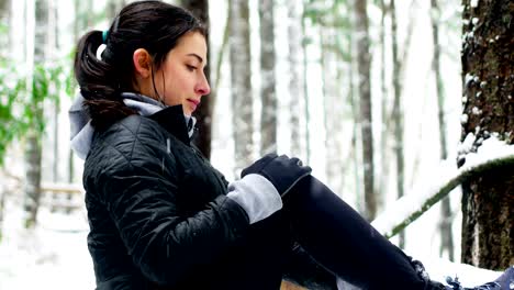 Beautiful-woman-exercising-during-snowfall