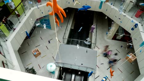 PAN-above-shot-of-shopping-center-with-paper-garlands-on-a-background.