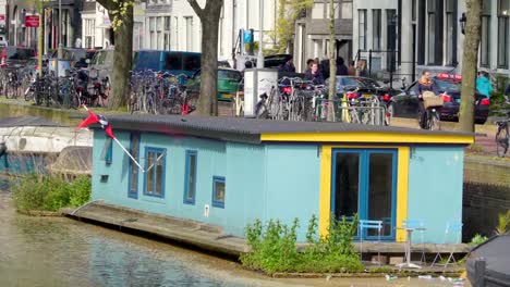 A-blue-bunk-house-near-the-side-of-the-canal