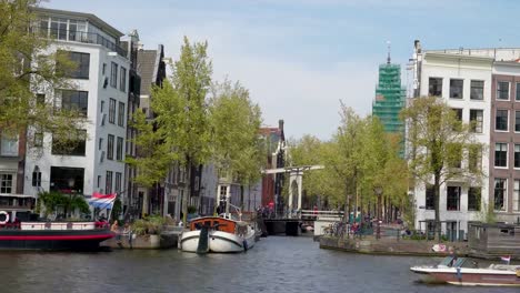 A-white-small-speedboat-crossing-the-big-canal