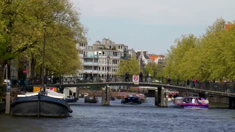 People-passing-by-the-long-bridge-in-Asmterdam