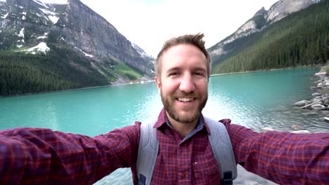 Hiker-capturing-selfie-portrait-at-Lake-Louise