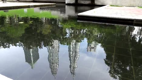 Reflection-in-water-Petronas-twin-towers-in-Kuala-Lumpur,-Malaysia