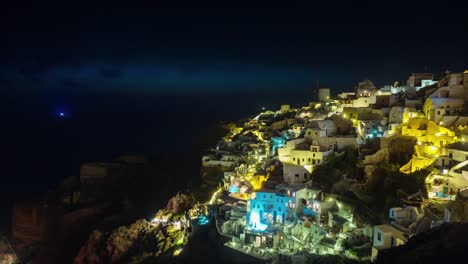 sunset-illuminated-santorini-island-oia-town-bay-hill-panorama-4k-time-lapse-greece