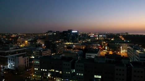 Night-city-aerial-establishing-shot