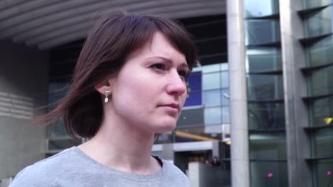 tourist-lady-walks-and-looks-at-attractions-near-the-European-Parliament-in-Brussels.-Belgium.-slow-motion.dolly-zoom-effect