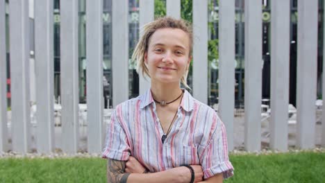 Young-Lady-with-Modern-Hairstyle-Smiling-Outdoors