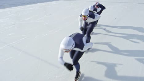 Sportswomen-in-Racing-Suits-Skating-on-Rink