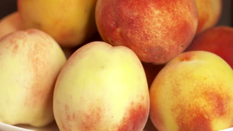 Fresh-sweet-peaches-turning-around.-Ripe-peach-fruit-background.