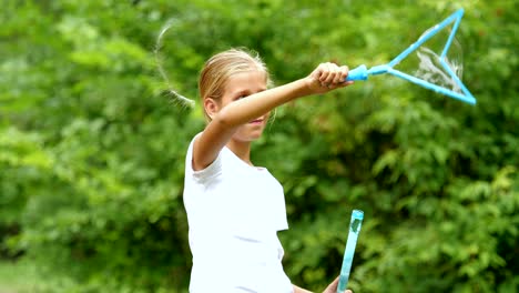 Little-girl-playing-with-soap-bubbles-outdoor.-Slow-motion.