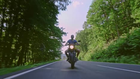 modern-scrambler-motorbike-on-the-forest-road-riding