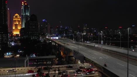 night-illuminated-kuala-lumpur-downtown-traffic-road-junction-aerial-panorama-4k-malaysia