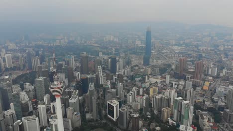 construcción-de-centro-torre-famosa-de-paisaje-urbano-Kuala-lumpur-aérea-Malasia-panorama-4k