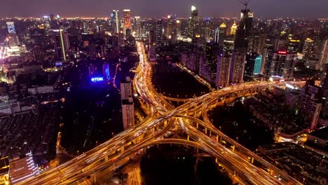 TL,-WS-Rush-hour-traffic-on-multiple-highways-and-flyovers-at-night-/-Shanghai,-China