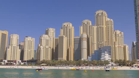 uae-dubai-marina-sunny-day-jbr-bay-palm-panorama-4k