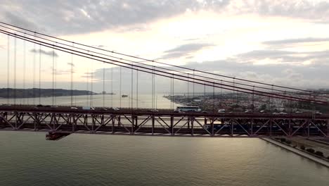 Cars,-trains,-bus-on-25-April-bridge-in-Lisbon-aerial-view