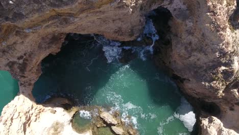 Aerial-view-of-Ponta-da-Piedade-rock-formations-in-Lagos,-Portugal