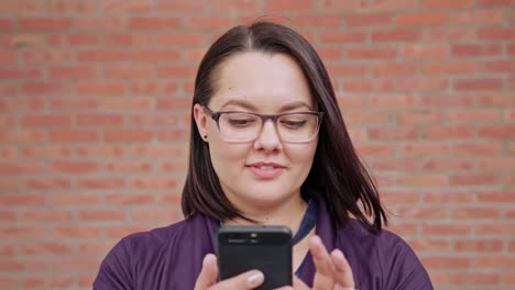 Young-Lady-wearing-Glasses-Using-Phone