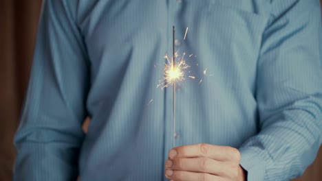 Footage-businessman-holding-sparkler-and-celebrating-new-year-or-success-business