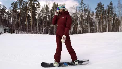 Follow-Shot-of-a-Female-Snowboarder