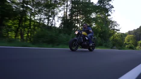 modern-scrambler-motorbike-on-the-forest-road-riding