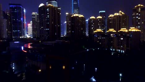 AERIAL-shot-of-Shanghai-cityscape-and-skyline-at-night/Shanghai,China