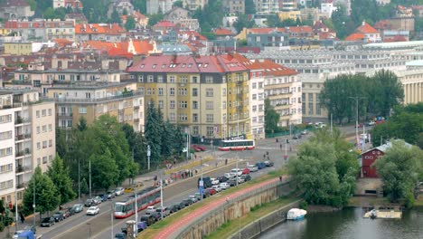 crossroad-in-old-european-city,-view-from-top,-vehicles-are-moving