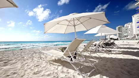 Caribbean-beach-with-sun-umbrellas-and-beds