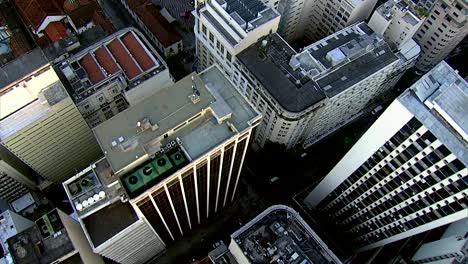 Flying-directly-over-city-buildings,-Rio-de-Janerio