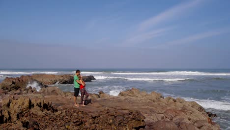 Romantic-couple-looking-away-at-sea