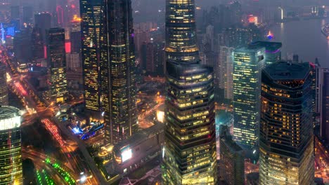 Time-lapse-of-Shanghai's-three-tallest-skyscrapers,-the-Shanghai-World-Financial-Center,-the-Jin-Mao-Tower,-and-the-Shanghai-Tower-at-sunset